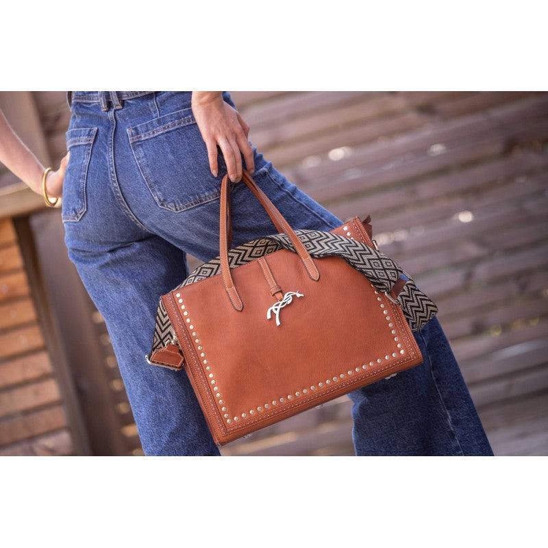 Penelope Naily Romane shoulder bag with wide adjustable herringbone strap.