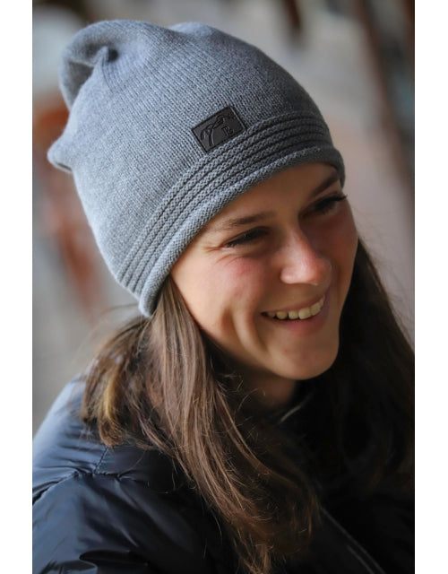 Penelope Nouki Hat with monochrome design and faux leather logo patch.