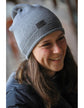 Penelope Nouki Hat with monochrome design and faux leather logo patch.