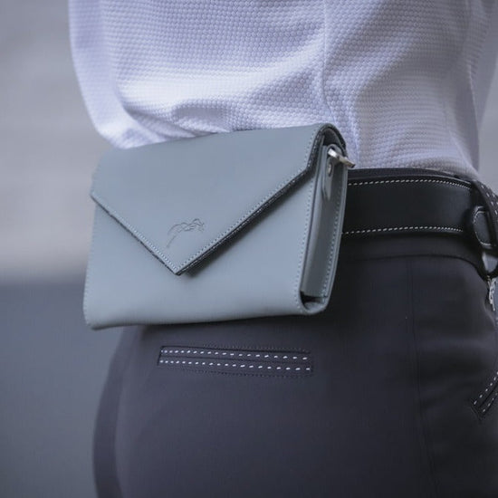 Penelope Perforated Phone Pocket crafted from 100% cowhide leather with embossed logo.