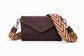 Penelope phone bag with black and off-white patterned removable shoulder strap.