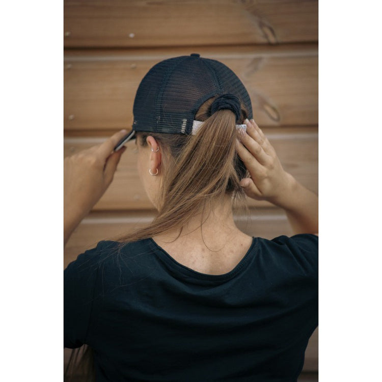 Penelope cap with detailed 3D logo embroidery and breathable mesh construction.