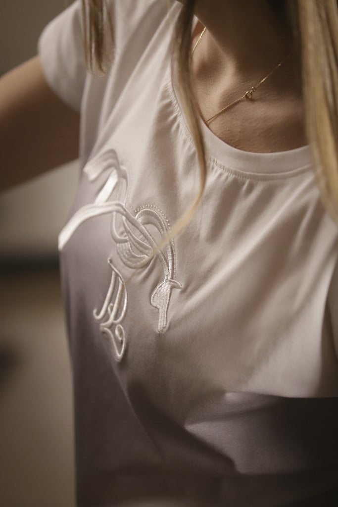 Penelope Poppy rhinestone T-shirt with a flattering feminine fit.