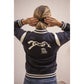 Penelope riding sweatshirt with zipped pockets for storing essentials.