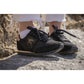 Penelope Saturne glitter trainers with shiny black laces and star logo detail.