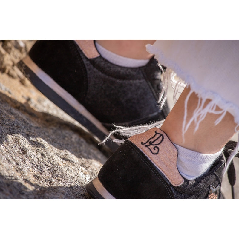 Penelope Saturne suede sneakers with signature logo and rose gold accents.