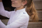 Penelope Seville Mesh junior competition shirt with white officer collar and half zip.