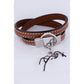 Penelope Signature leather bracelet with white saddle stitching.