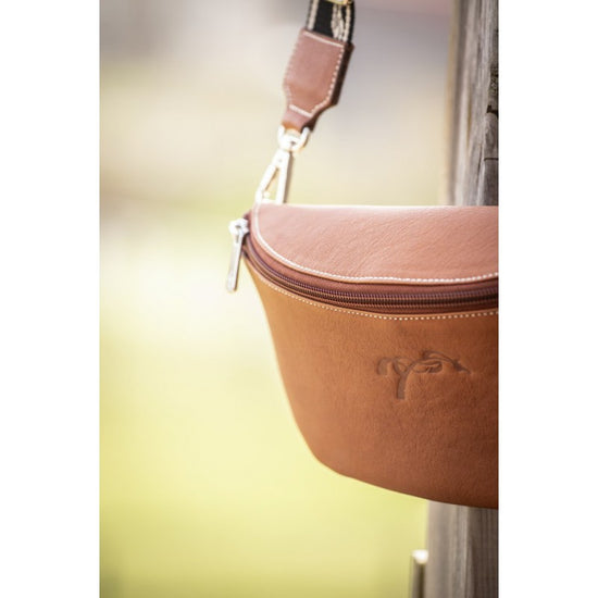 Penelope Smile leather waist bag with practical front and back zippered compartments.