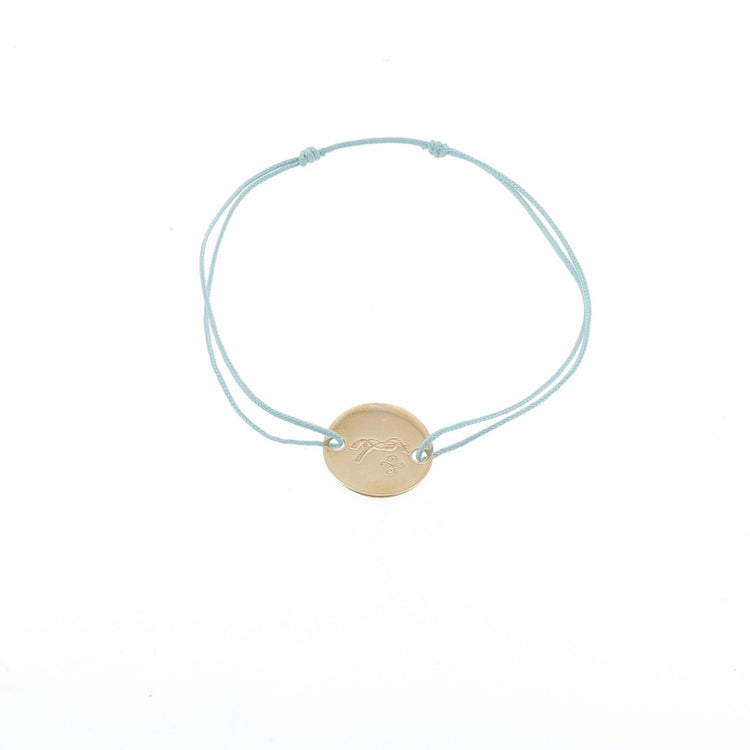 Penelope Zoe Gold Bracelet with delicate cord and round gold-plated horse logo plate