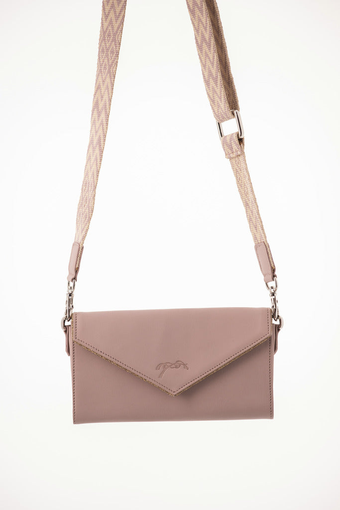 Perforated crossbody phone pouch with removable strap for stable, riding and everyday use.