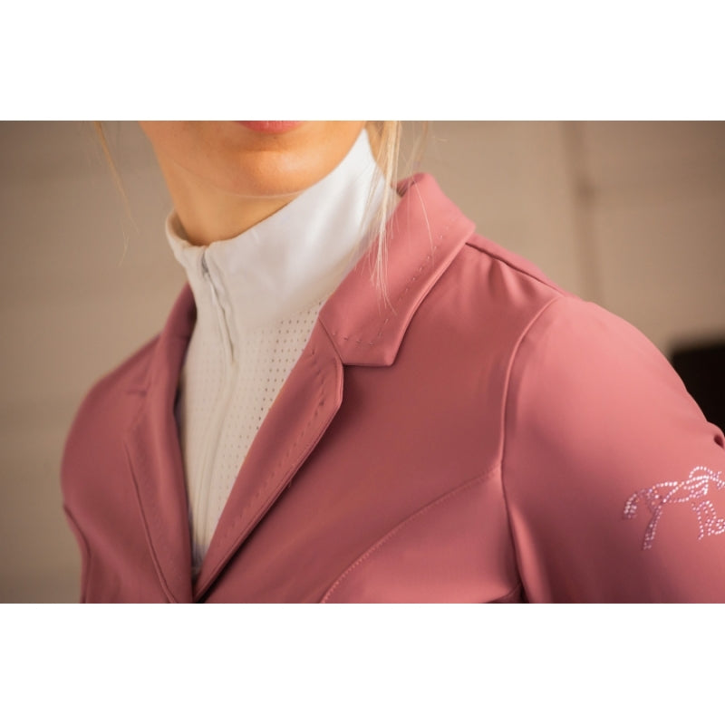 Pink equestrian competition jacket with elegant detailing and a feminine fitted silhouette.