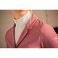 Pink equestrian competition jacket with elegant detailing and a feminine fitted silhouette.