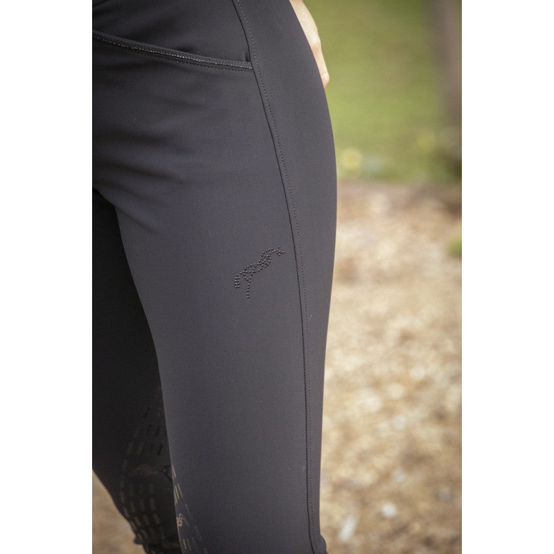 Rhinestone riding breeches for women with decorative pocket detailing.