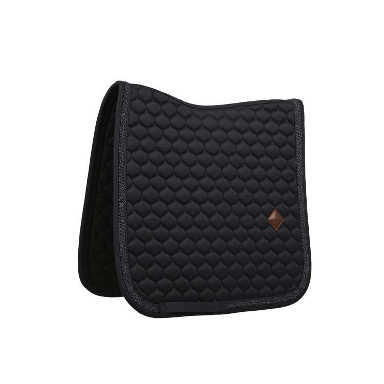 Saddle pad with elegant plaited glitter rope around the edge