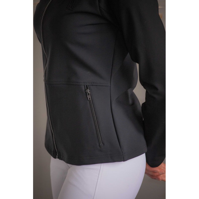 Second-skin equestrian riding jacket with a feminine fitted silhouette and high collar.