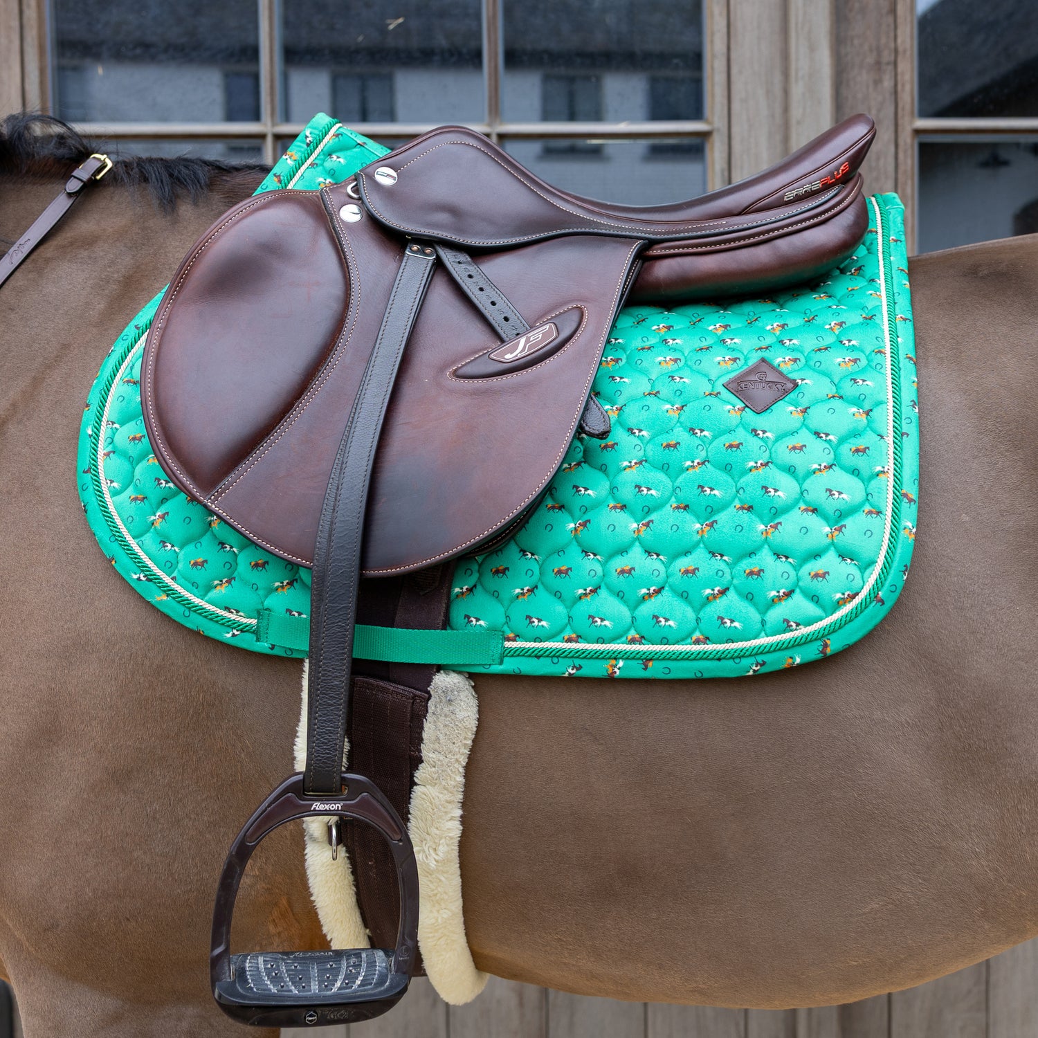 Star quilted velvet jumping saddle pad with nylon girth strap