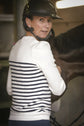 Striped knit sweater with puff sleeves and feminine shoulder button detailing.