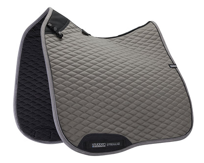 Horse wearing the Stübben Streamline GEN2 Dressage Pad beneath a dressage saddle.