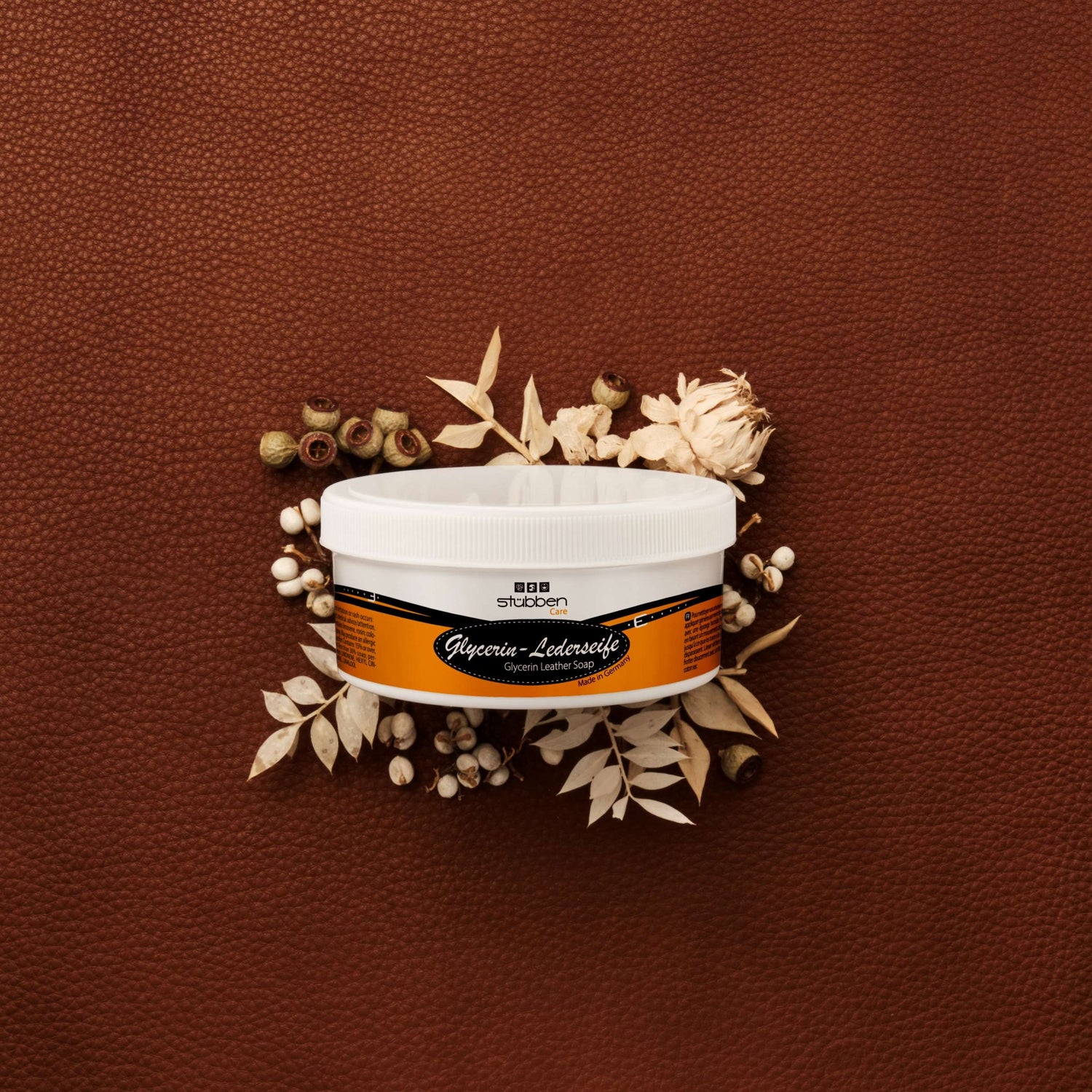 Stübben Glycerin Leather Soap alongside saddle and bridle care accessories.