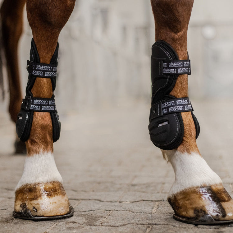 Close-up of the fastening system and contoured fit of the Stübben jumping boots.