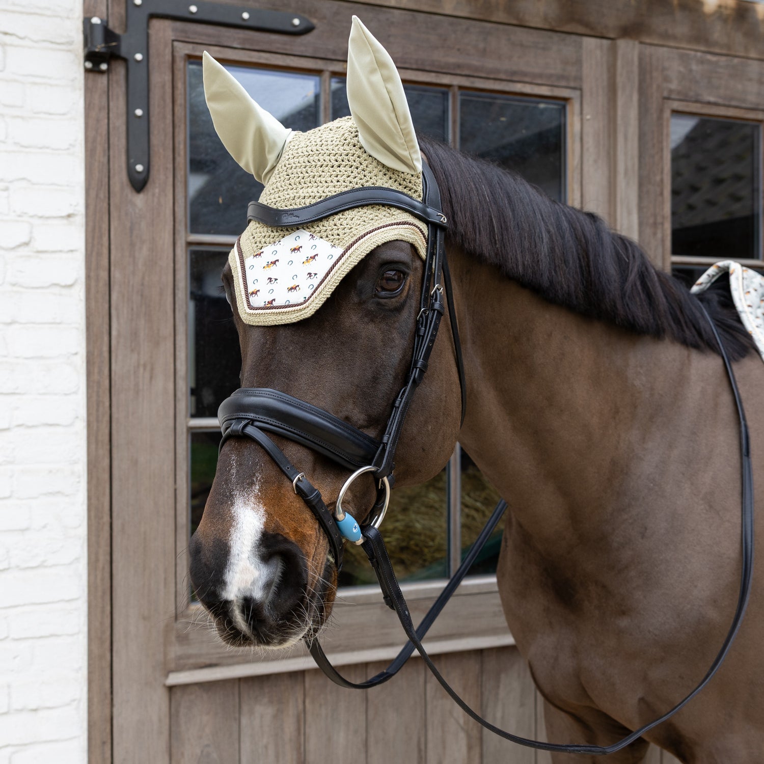 Velvet horse print fly veil designed to protect the ears against flies