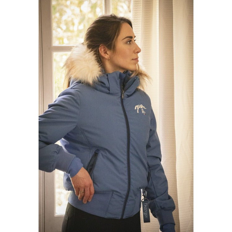 Warm equestrian jacket for women during winter riding and stable work.