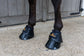 Water-repellent overreach boots that remain lightweight in wet conditions