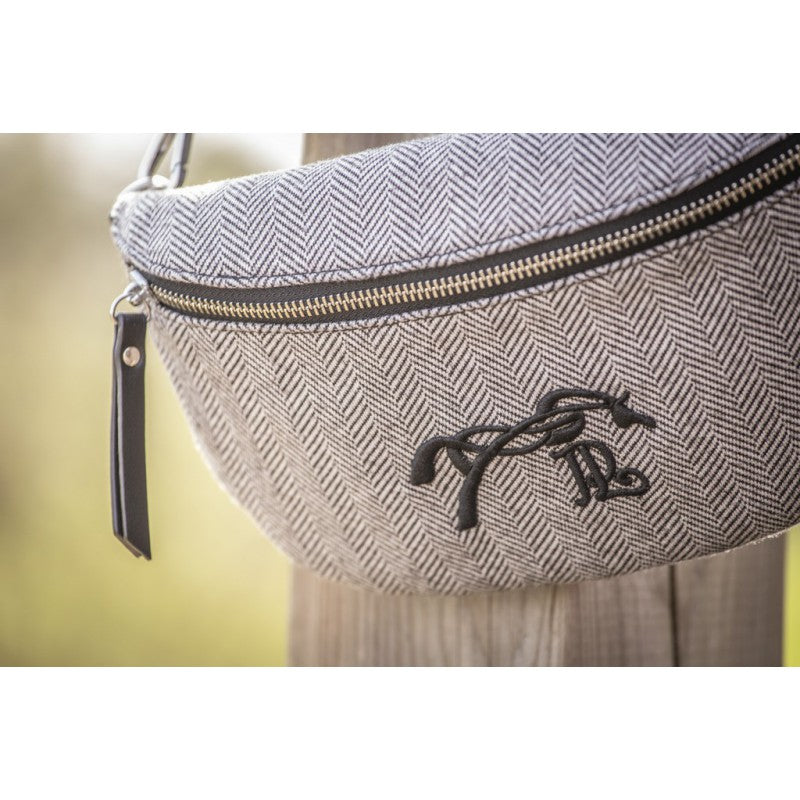 Equestrian crossbody waist bag with multiple zipped pockets for secure everyday storage.