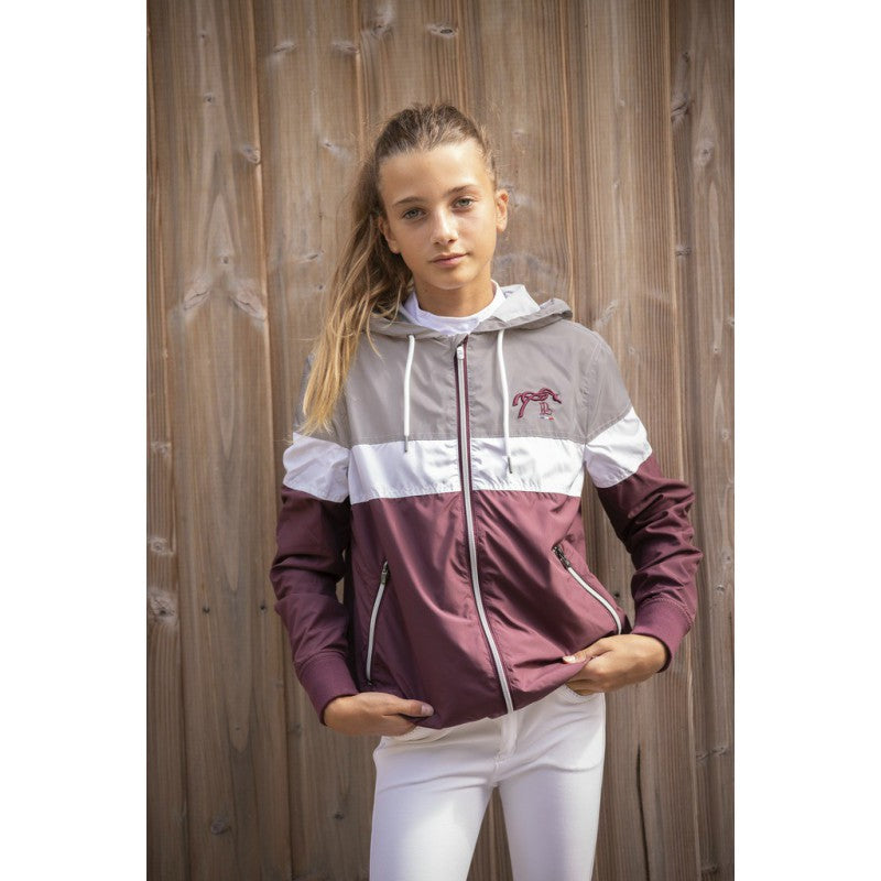 Women’s equestrian windbreaker for riding and stable wear.