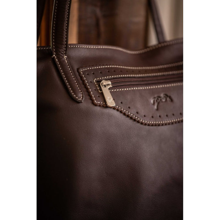 Leather tote bag for women with spacious interior and secure zip closure.