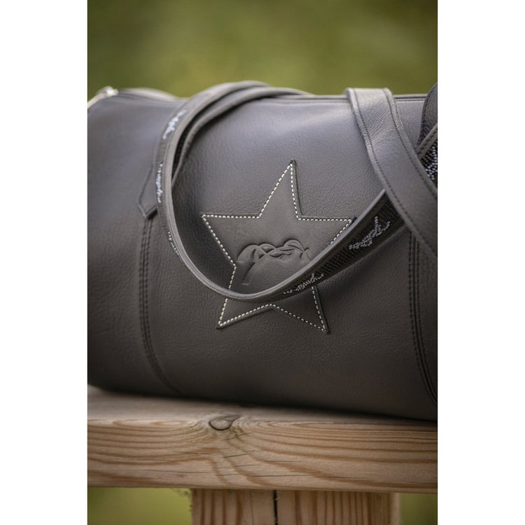 Women’s leather weekend bag with beige cotton interior lining.