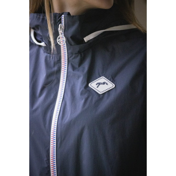 Women’s waterproof riding jacket for training and stable activities in the rain.