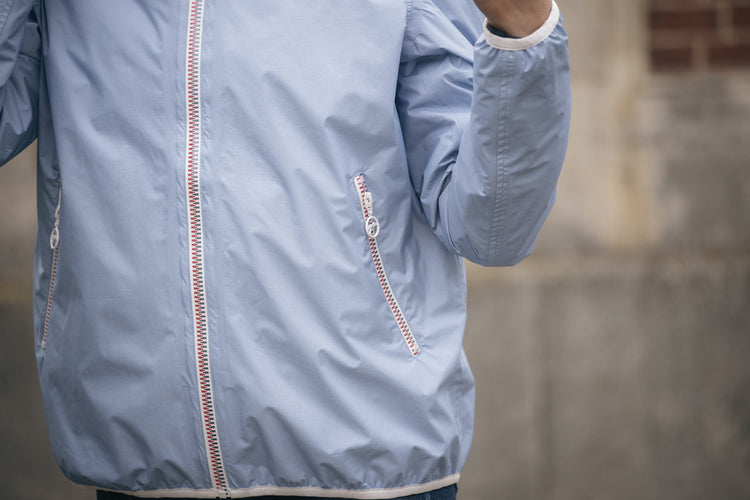 Breathable horse riding rain jacket for wet-weather equestrian use.