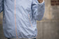 Breathable horse riding rain jacket for wet-weather equestrian use.