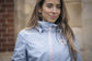 Equestrian rain jacket for women with a comfortable loose-fitting design.