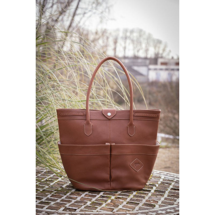 Leather stable bag for horse riders with practical storage compartments.