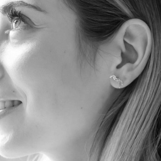Penelope horse logo earrings with an elegant equestrian look.
