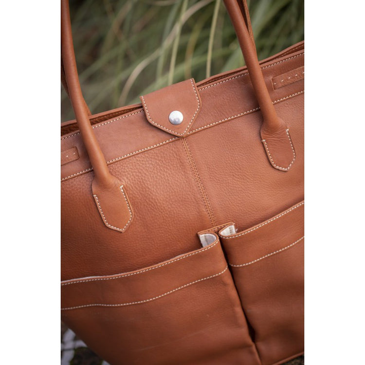 Penelope Maisons Laffitte stable bag with logo badge and practical pockets.