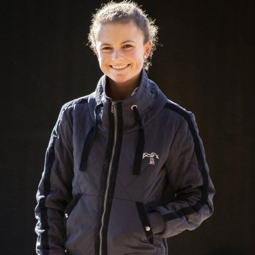 Penelope Luka equestrian jacket with elegant velvet detailing along the sleeves.