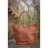 Penelope Maisons Laffitte Grooming Bag made from leather with multiple storage pockets.