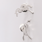 Penelope Millie Earrings with a subtle horse logo design.