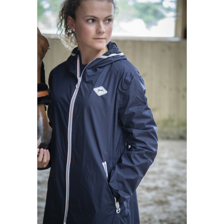 Penelope Rain Day riding jacket with distinctive blue, white and red zipper.