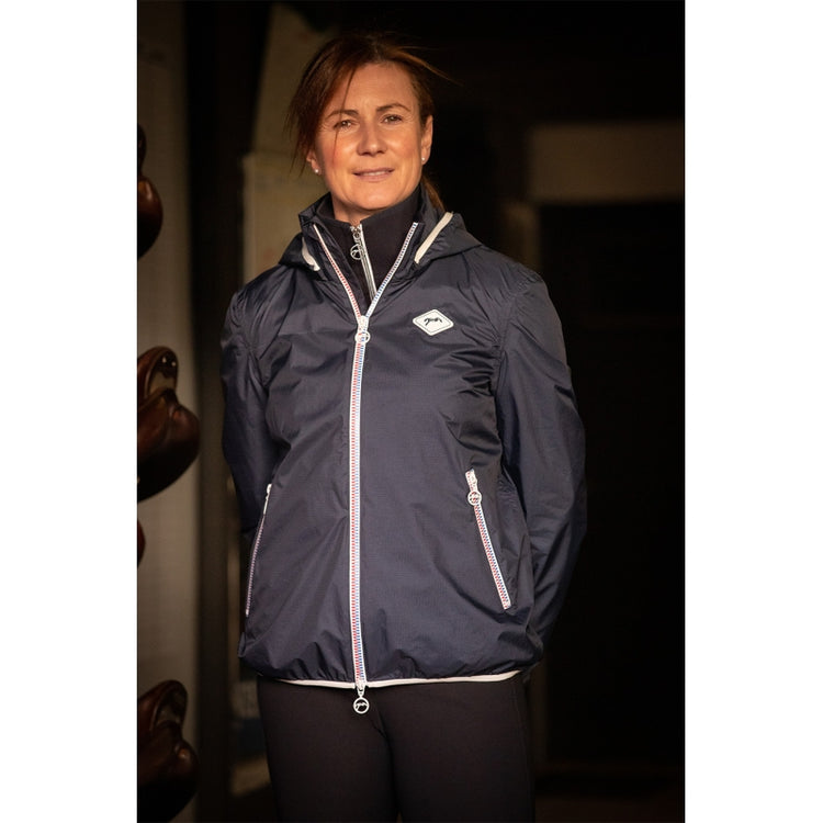 Waterproof jacket for horse riders during rainy training and stable days.