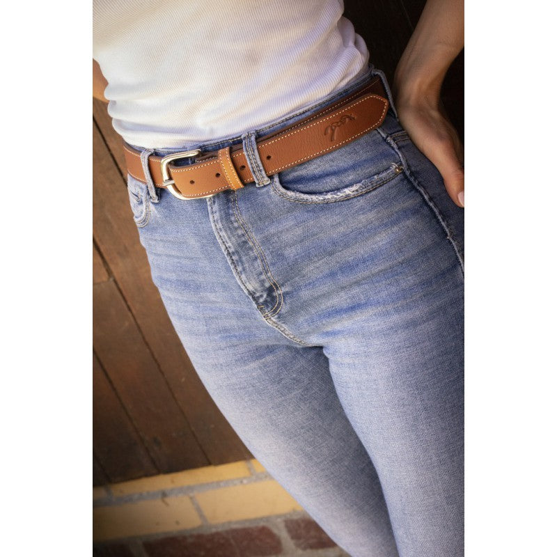 Penelope riding belt with signature logo embossed at the end.
