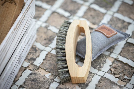 Penelope Soft Head Brush with wooden handle for precise horse grooming.