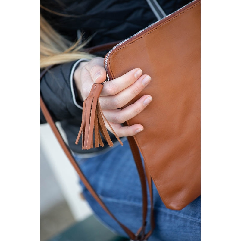 Penelope thin leather laptop sleeve with decorative leather tassel.