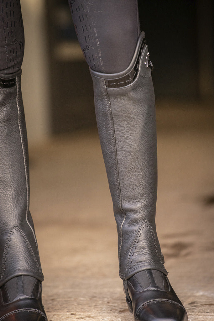 Penelope women’s leather half chaps with elegant patent leather detailing.