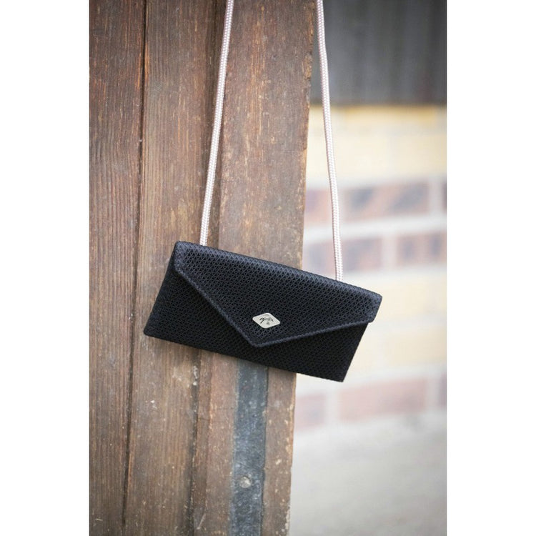 Rider smartphone holder for equestrian training and competition.