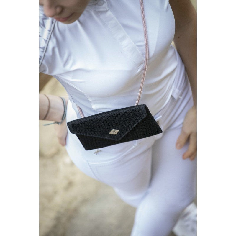 Equestrian phone holder for carrying a smartphone while riding.